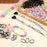 1602pcs Beads Kit for Hair Braids Including 600pcs 9x6mm Macaron Pony Beads, 1000pcs Elastic Rubber Bands, and 2pcs Quick Beaders for Kids Hair Braids (Macaron)