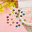 DanLingJewelry 84pcs Random Color Handmade Millefiori Lampwork Flat Round Beads Glass Flower Round Loose Beads for DIY Jewelry Making